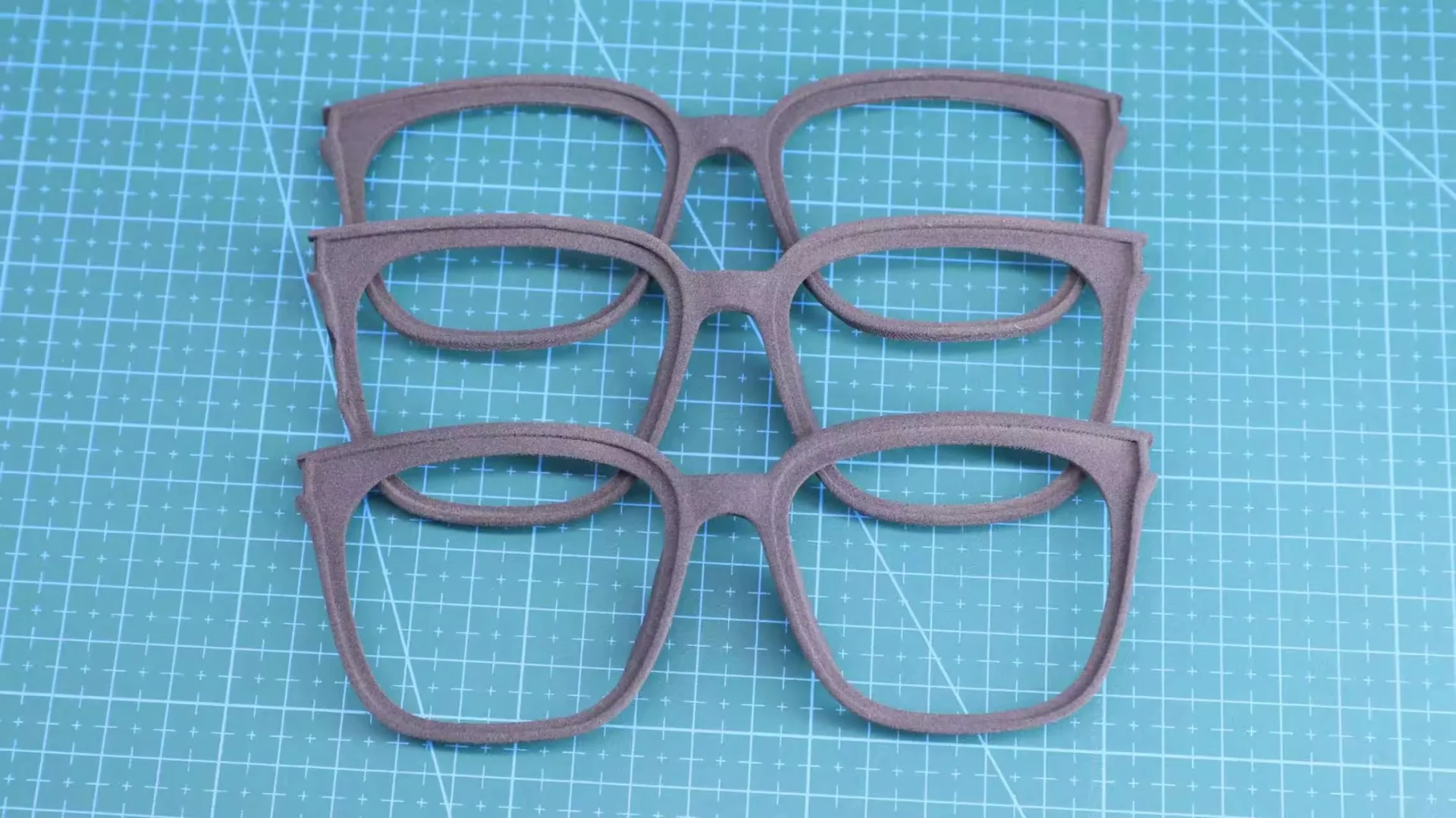 Close-up view of SLS printed glasses frame, showing surface finish of 3D sintered polymer part